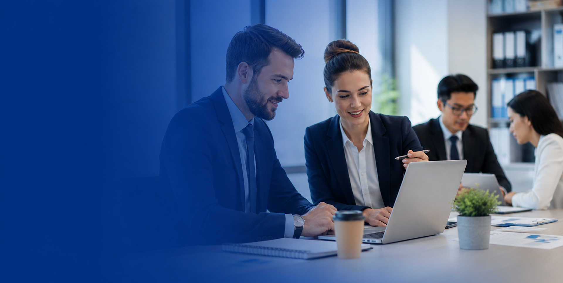 Business professionals discussing trademark monitoring in an office